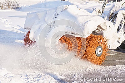 Rotating brush of a snowblower at work close up Stock Photo