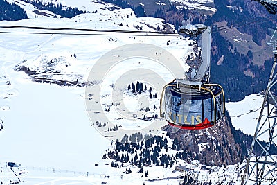 Rotating cable car of Titlis glacier approaching summit station Editorial Stock Photo