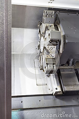 Rotating head in a high precision mechanics plant at CNC lathe Stock Photo