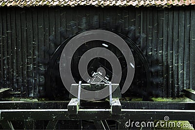 Rotating water wheel of the historic oil mill of the Twickel estate. Stock Photo