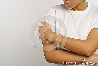 Worried african american woman suffering from shoulder joint pain, bursitis or arthritis disease Stock Photo