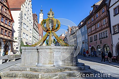 Colorful easter decoration at a fountain in Rothenburg ob der Tauber Editorial Stock Photo
