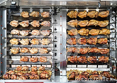 Rotisserie chickens spit roasted at a French street market Stock Photo