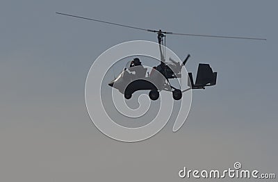 Rotorcraft and pilot taking pictures Editorial Stock Photo