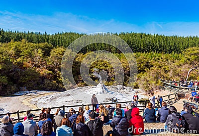 ROTORUA, NEW ZEALAND - OCTOBER 10, 2018: Crowds sitting to watch daily eruption of Lady Knox Geyser in Wai-o-Tapu Editorial Stock Photo