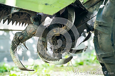 Rototiller of a walk-behind tractor close-up. Agricultural machinery for processing and care of the soil. Small tractor for Stock Photo