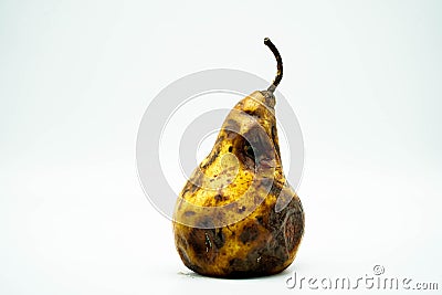 Rotten decay pear isolated on white background. Unhealthy food for people Stock Photo