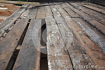 Rotten roof timbers, wood rafters, ceiling roof joists badly needs repairing, removing and replacing Stock Photo