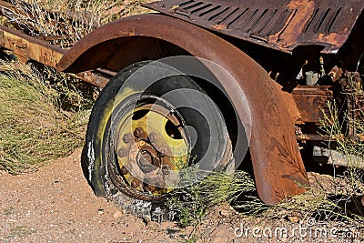 Rotten tire part of a junked truck Stock Photo