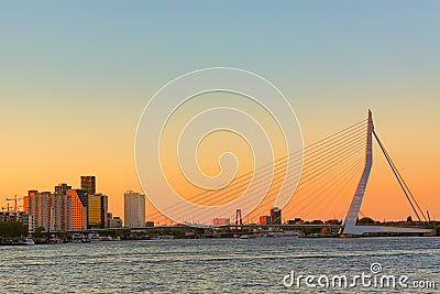 Rotterdam panorama. Erasmus bridge over the river Meuse with skyscrapers in Rotterdam, South Holland, Netherlands during twilight Editorial Stock Photo