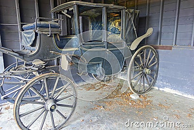 Rotting Horse Carriage in Rustic Rural Farm Barn Stock Photo