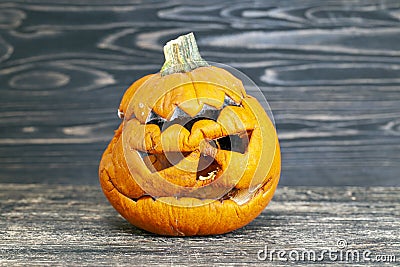 carved from pumpkin frightening face in mold and mildew during decomposition Stock Photo