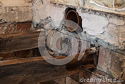 Rotton broken floor joists exposed during home renovations Stock Photo