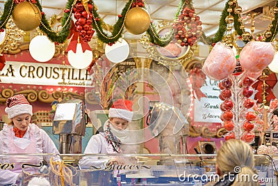 ROUEN, FRANCE - DECEMBER 16, 2018: Christmas decorated Kiosk with sweets at the Fair in Europe Editorial Stock Photo