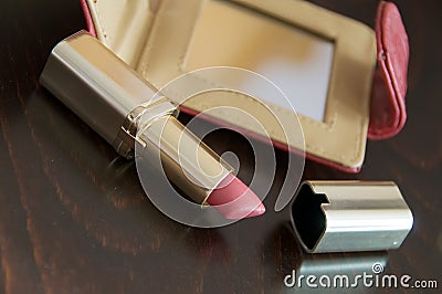 Rouge lipstick and mirror Stock Photo