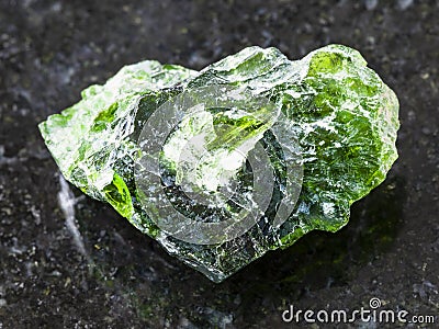 rough crystal of Chrome Diopside gemstone on dark Stock Photo