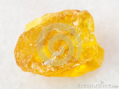 rough crystal of sulphur stone on white marble Stock Photo