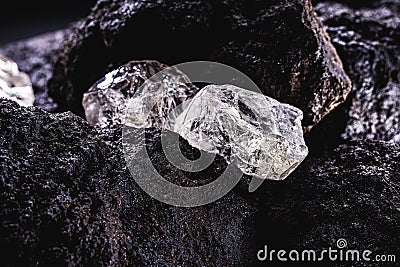 Rough diamond precious stone in mines. Concept of mining and extraction of rare ores Stock Photo