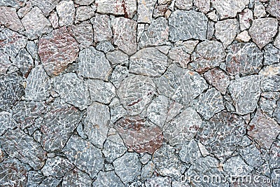 Rough gray natural stone wall Stock Photo