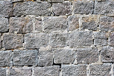 Rough grey natural stone wall Stock Photo