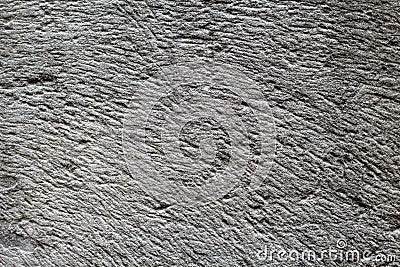 Rough grey stone texture photo. Ancient polished stone background. Weathered rock relief. Stock Photo