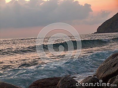 Rough sea at sunset Stock Photo