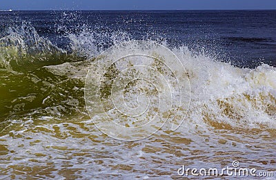 Rough seas and inclement weather breaking ocean waves Stock Photo