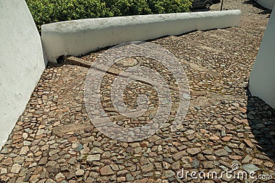 Rough stone pavement in a pathway made of large stairs Stock Photo