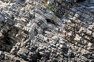 Rough surface of rock with slanting stratum Stock Photo