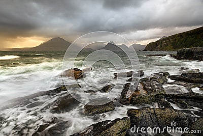 Rough waves crashing on rocky shoreline at Elgol on the Isle of Skye, Scotland, UK. Stock Photo