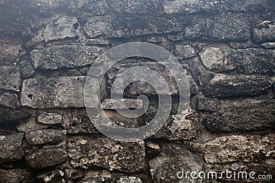 Rough weathered ancient mayan stone wall surface texture close up Stock Photo