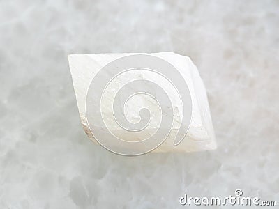 rough white calcite stone on white marble Stock Photo