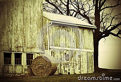 Round Bale and Barn sepia Stock Photo