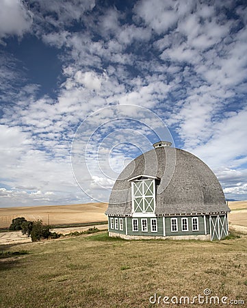 Round barn against a blue sky. Stock Photo