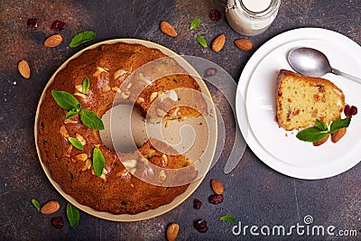 Round biscuit cake with almond nuts, raisins and dried cranberries Stock Photo