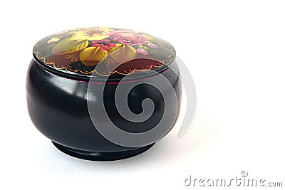 Round black casket with a pattern of flowers on a white background Stock Photo