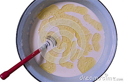 Semi-finished product for making pancakes-dough, in a round dish, close - up, copy space, isolated, instagram. Stock Photo