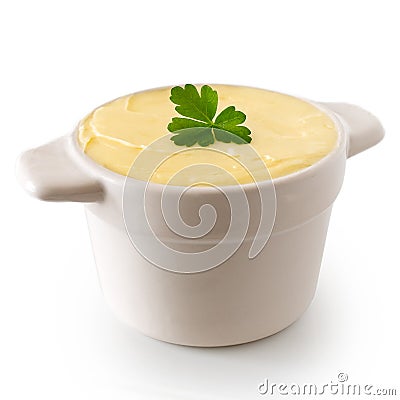 Round ceramic dish filled with butter isolated on white. Parsley Stock Photo