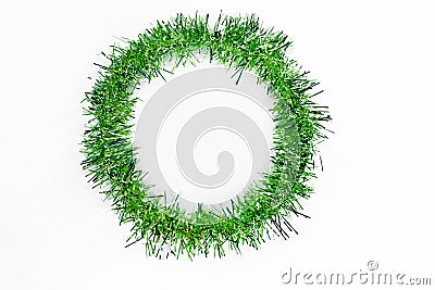 Round circle of bright green tinsel on a white background. Christmas decorations. New year Stock Photo