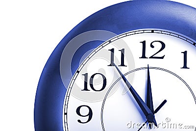 Round clock showing time about twelve isolated Stock Photo