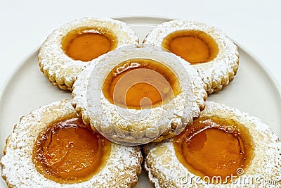 Round cookies with fruit jam and icing sugar, italian occhi di bue, on white Stock Photo