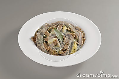 Round dish with a portion of pizzoccheri Stock Photo