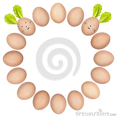 Round Easter frame made of brown eggs. Closeup photos of isolated eggs, some of them with funny rabbit faces and ears. Stock Photo