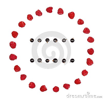 Round frame made of raspberry and rows of black currant isolated on white background. Flat lay. Stock Photo