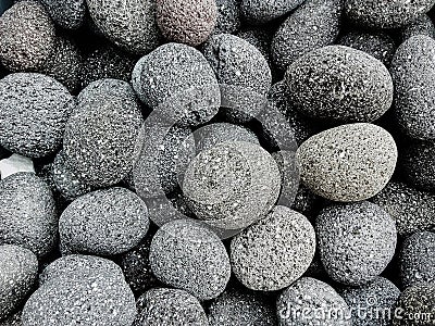Round gray stones used to decorate the garden or parts of the house Stock Photo
