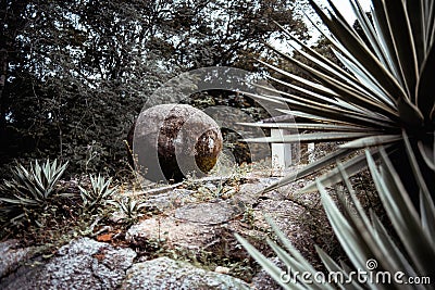 A round heavy stone in a park Stock Photo