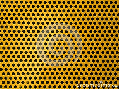 Round holes in yellow perforated metal plate Stock Photo