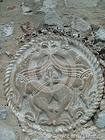 Round medieval stone carving representing birds Stock Photo