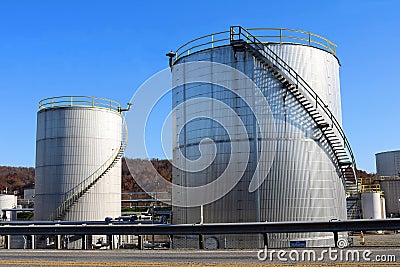 Two Metallic Round Chemical Storage Tanks Stock Photo