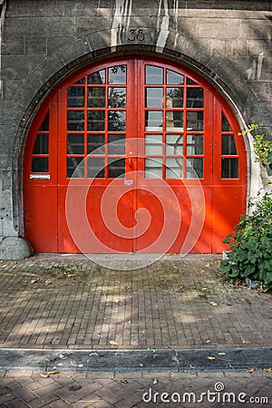 Round Orange Door in Amsterdam Stock Photo